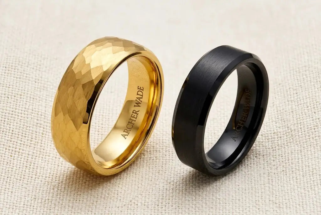 Two men's tungsten wedding bands side by side showing 8mm and 6mm width difference on cream linen