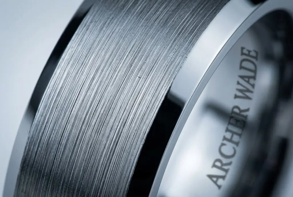 Macro detail of a brushed tungsten wedding band's surface texture showing the material's character